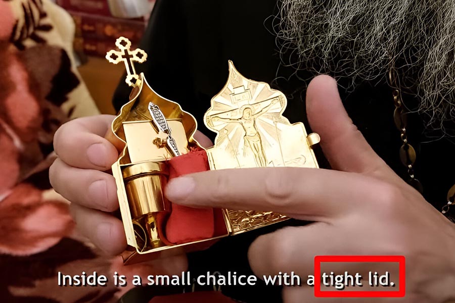 Father Andrey shows his Chalice with a tight lid.