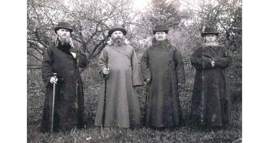 The clergy of the Russian Empire in traditional attire outside the church.