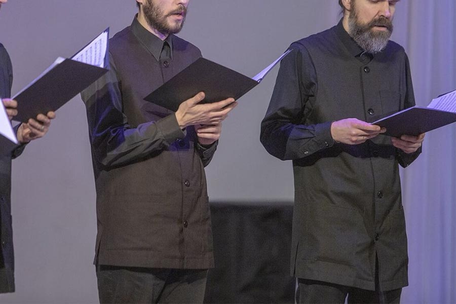Brother's choir of St.Elisabeth Convent performs in vests at a concert