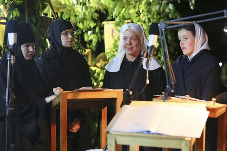 Sister Veronica is getting ready for Transfiguration liturgy at night, 2018