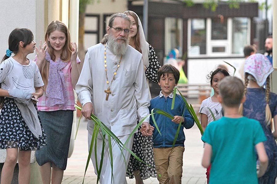 Father Sergius with his children at the Pentecost service.
