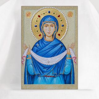 Icon of the Mother of God Protection n blue vestment with pearls and semi-precious stones