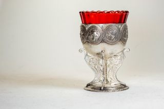 vigil lamp covered with silver and with a glass cup
