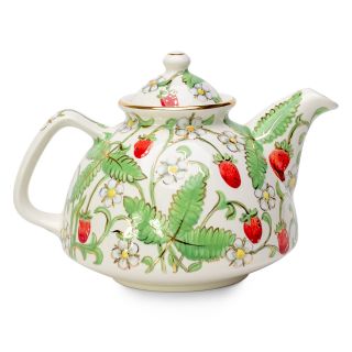 handmade nice summer teapot with berries flowers leaves