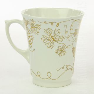 handmade ceramic cup with a decal and gold elements