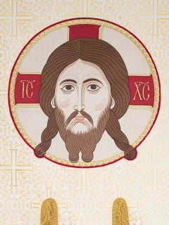 white silk church banner with an icon 