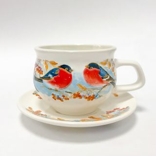 ceramic cup with bullfinch on the branch