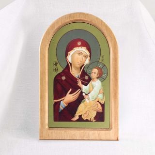 wooden icon with printed the Mother of God on golden background
