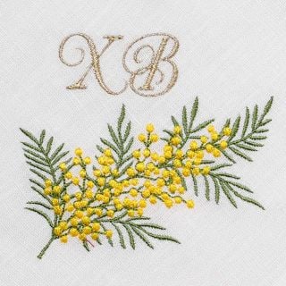 red Table napkin with embroidered mimosa