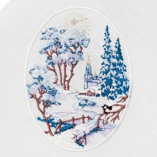 white linen table napkin with embroidered winter scenery