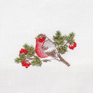 white linen table napkin with embroidered robin and rowan