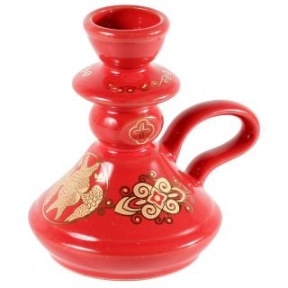 white ceramic candleholder with patterns