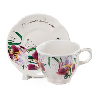 ceramic tea cup and a saucer with lily-of-the-valley picture