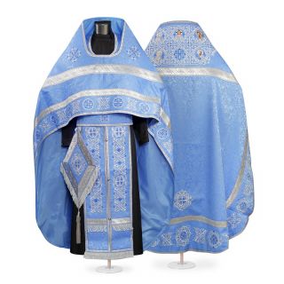 blue decorative priest vestment with embroidered Paschal patterns with Saints