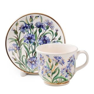 ceramic cup and saucer set with blue hand-painted cornflowers