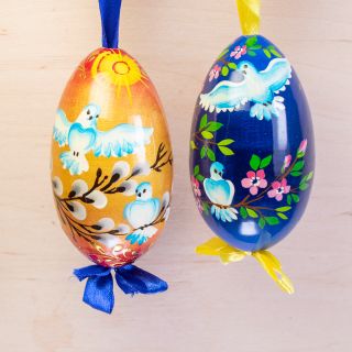 doves and palm tree in wooden eggs