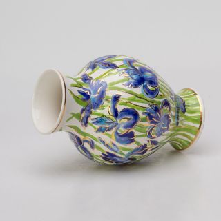 Iris flowers in ceramic vase
