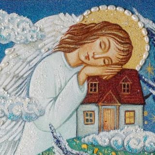 the framed picture of the angel hugging the house in the storm