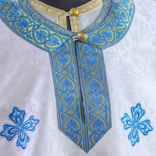 white greek-style priest vestment with blue embroidery 