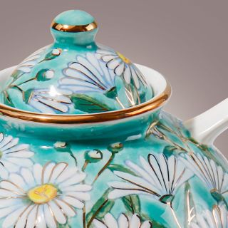 ceramic teapot with hand-painted daisies