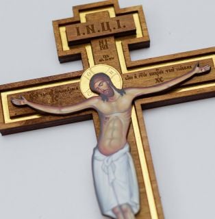 wooden wall crucifix with golden elements