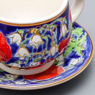 hand-painted coffee cup and saucer set with hand-painted poppies