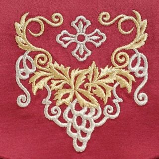 red case with embroidered grapes and a button