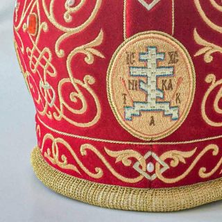 red velvet mitre with embroidered icons of saints