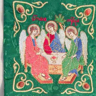 green bookmark with the Holy Trinity