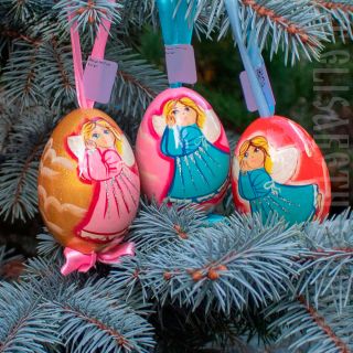souvenir wooden egg angel on the ribbon