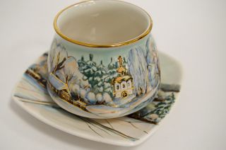 Village in winter ceramic cup