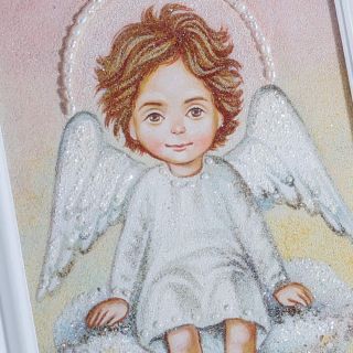 Picture of a baby angel on a cloud