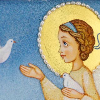 Handmade picture of crushed semi-precious stones of an angel with dove