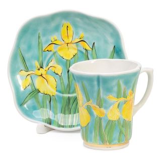 yellow irises in blue ceramic tea set and a saucer set