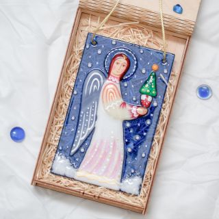 festive glass angel with a chrismas tree