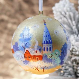 golden sparkling bauble with a church painting