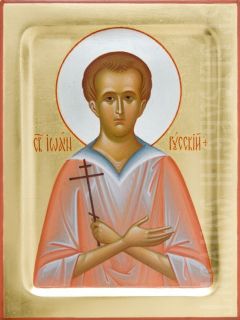painted icon of St John the Russian, the background is covered with gold leaf