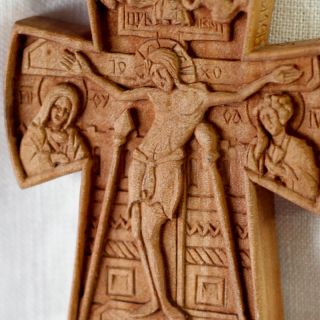 wooden hand carved cross with Jesus