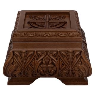 wooden reliquary with carved cross