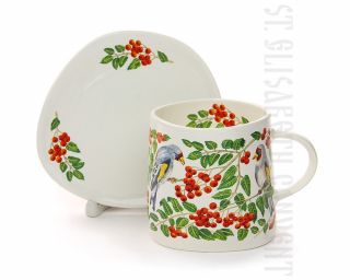 big cup with a fancy shaped saucer birds and rowan branches