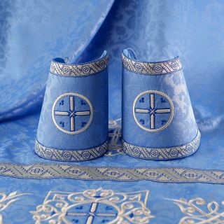 blue decorative priest vestment with embroidered Paschal patterns with Saints