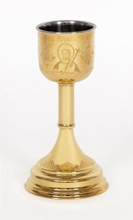 gilded chalice with engraved icons of Jesus and crosses