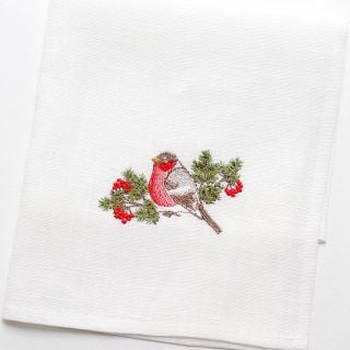 white linen table napkin with embroidered robin and rowan