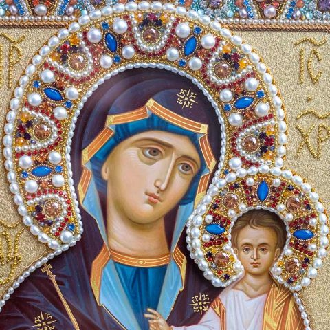 Icon of Mother of God hand-painted with textile oklad