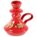 white ceramic candleholder with patterns