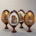 wooden eggs with icons and colorful backgrounds