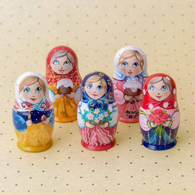 nesting dolls with coloured eggs before Easter