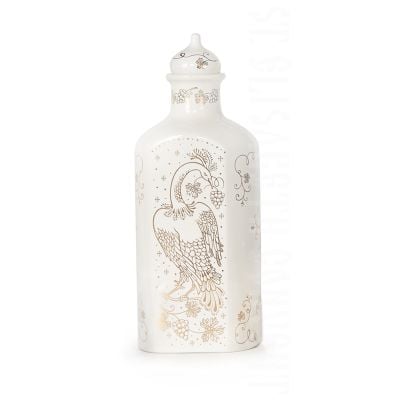 white ceramic bottle with grapes and a bird