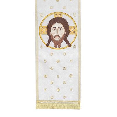 white analogion cover with medallion of Christ and tassels