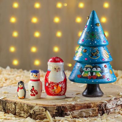 Christmas blue nesting tree doll with painted penguins and balls